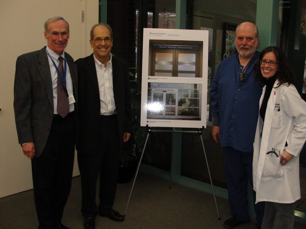 Dr. Wharton and others pictured with a rendering of the new signage for the Interventional Cardiovascular Lab